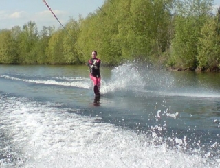 Water skiing involves being led by a speedboat attached to a cable
